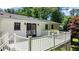 Back exterior featuring a white deck, sliding glass doors, and a cozy outdoor space at 612 Harvest Ln, Raleigh, NC 27606