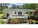 A white house exterior featuring a deck, a door, and an outdoor seating area at 612 Harvest Ln, Raleigh, NC 27606