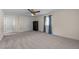 Large carpeted bedroom features a closet, ceiling fan, and natural light from a window at 612 Harvest Ln, Raleigh, NC 27606