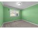 Small bedroom with carpet and single window at 612 Harvest Ln, Raleigh, NC 27606
