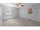 Bright bedroom with carpet, ceiling fan, and a neutral color palette at 612 Harvest Ln, Raleigh, NC 27606