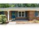 Close-up of front entrance with brick facade and blue door at 612 Harvest Ln, Raleigh, NC 27606