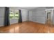 Large living room showcasing hardwood floors and plenty of open space at 612 Harvest Ln, Raleigh, NC 27606
