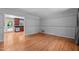 Bright living room with gleaming hardwood floors and neutral paint at 612 Harvest Ln, Raleigh, NC 27606