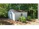 Outdoor storage shed located in a wooded backyard setting at 612 Harvest Ln, Raleigh, NC 27606