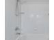 Bright bathroom shower with white tile and updated shower head fixtures at 612 Harvest Ln, Raleigh, NC 27606