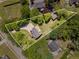 Aerial view of a home with a private driveway and backyard surrounded by mature trees and a outlined property at 6225 Jones Farm Rd, Wake Forest, NC 27587