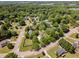 This aerial view showcases a neighborhood with tree-lined streets and well-maintained homes at 6225 Jones Farm Rd, Wake Forest, NC 27587