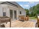 Backyard featuring a wooden deck and a patio with raised garden beds at 6225 Jones Farm Rd, Wake Forest, NC 27587