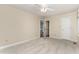 Bright bedroom with neutral walls, carpeted floor, ceiling fan, and closet door at 6225 Jones Farm Rd, Wake Forest, NC 27587