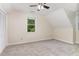 Cozy bedroom with a large window, closet, carpeted floors, and a ceiling fan at 6225 Jones Farm Rd, Wake Forest, NC 27587