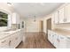Bright kitchen with white cabinets, neutral countertops, and modern appliances, offering a functional and stylish cooking space at 6225 Jones Farm Rd, Wake Forest, NC 27587