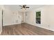 Cozy living room with vinyl flooring, stairs and a window showcasing the outdoor greenery, creating a peaceful ambiance at 6225 Jones Farm Rd, Wake Forest, NC 27587