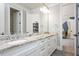 Well-lit bathroom with double vanity, granite counters, and sleek fixtures offers style and function at 6502 New Market Way, Raleigh, NC 27615