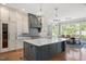 Stunning kitchen boasts granite countertops, stainless steel appliances, and a sunlit dining area at 6502 New Market Way, Raleigh, NC 27615