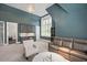 Spacious room features a wet bar with custom cabinetry, a large window, and comfortable seating at 6502 New Market Way, Raleigh, NC 27615