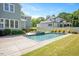 Inviting pool area with a hot tub and manicured landscaping for a relaxing outdoor space at 6502 New Market Way, Raleigh, NC 27615