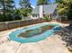 Aerial view shows a covered swimming pool and fenced yard at 6513 Cablewood Dr, Raleigh, NC 27603