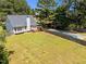 Aerial view of the home featuring a large, lush yard and a covered pool at 6513 Cablewood Dr, Raleigh, NC 27603