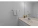 Bathroom vanity with a white sink, faucet, and a mirror at 6513 Cablewood Dr, Raleigh, NC 27603