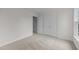Neutral carpet in bedroom featuring closet space and natural light at 6513 Cablewood Dr, Raleigh, NC 27603
