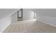 Upstairs bedroom featuring a neutral carpet and ample space at 6513 Cablewood Dr, Raleigh, NC 27603