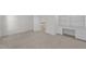 Bedroom with built-in desk and shelving, and neutral carpeting at 6513 Cablewood Dr, Raleigh, NC 27603