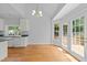 Dining area with hardwood floors and natural light coming from French doors leading to the outside deck at 6513 Cablewood Dr, Raleigh, NC 27603