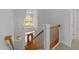 Bright entryway features a wood-trimmed front door and staircase with decorative windows and abundant natural light at 6513 Cablewood Dr, Raleigh, NC 27603