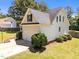 Rear exterior view of a well-kept home showing manicured lawn and an attached two-car garage at 6513 Cablewood Dr, Raleigh, NC 27603