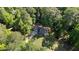 Overhead aerial view of a traditional-style house situated on a private, tree-lined lot at 6517 Hidden Pond Rd, Wendell, NC 27591
