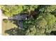 Aerial view of the property showcasing its spacious lot, mature trees, and convenient circular driveway at 6517 Hidden Pond Rd, Wendell, NC 27591