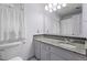 Bathroom featuring granite counters and neutral tiling at 6517 Hidden Pond Rd, Wendell, NC 27591