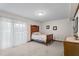 Spacious bedroom featuring plush carpets, and walkout to balcony at 6517 Hidden Pond Rd, Wendell, NC 27591