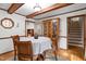 Traditional dining room featuring wood beams and wood china cabinet at 6517 Hidden Pond Rd, Wendell, NC 27591