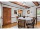 Dining room with wood features, round table, and adjacent kitchen entrance at 6517 Hidden Pond Rd, Wendell, NC 27591