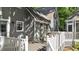Backyard home exterior with white trim detail, wooden deck and access to the screened in gazebo at 6517 Hidden Pond Rd, Wendell, NC 27591