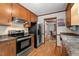 Well-equipped kitchen featuring stainless steel appliances and granite countertops at 6517 Hidden Pond Rd, Wendell, NC 27591