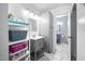 Bright bathroom with marble floors, updated vanity, and ample storage at 6565 New Market Way, Raleigh, NC 27615