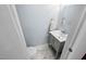 Cozy bathroom featuring updated vanity, marble floors, and fresh, neutral walls at 6565 New Market Way, Raleigh, NC 27615