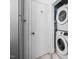 Convenient laundry area with stacked washer and dryer for efficient space-saving at 6565 New Market Way, Raleigh, NC 27615
