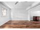 Spacious living room featuring hardwood floor and an open floor plan at 6565 New Market Way, Raleigh, NC 27615