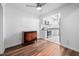 Open-concept living area featuring hardwood floors and access to a modern kitchen at 6565 New Market Way, Raleigh, NC 27615