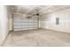 Spacious two car garage with concrete floors and drywall walls at 680 Winesap Dr, Graham, NC 27253
