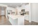 Modern kitchen with white cabinets, stainless steel appliances, and a large island at 680 Winesap Dr, Graham, NC 27253