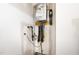 Wall-mounted Rinnai tankless water heater in utility space at 680 Winesap Dr, Graham, NC 27253