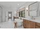 Bright bathroom with dual vanities, freestanding tub, and stylish fixtures at 702 Wimbleton Dr, Raleigh, NC 27609