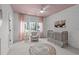 Charming Bedroom featuring a patterned wallpaper, wainscoting, and a classic crib at 702 Wimbleton Dr, Raleigh, NC 27609