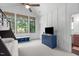 Bright bedroom with a bunk bed, a large window, and a blue storage bench at 702 Wimbleton Dr, Raleigh, NC 27609