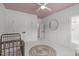 A well-appointed Bedroom with white trim, closet, and a round decorative rug at 702 Wimbleton Dr, Raleigh, NC 27609